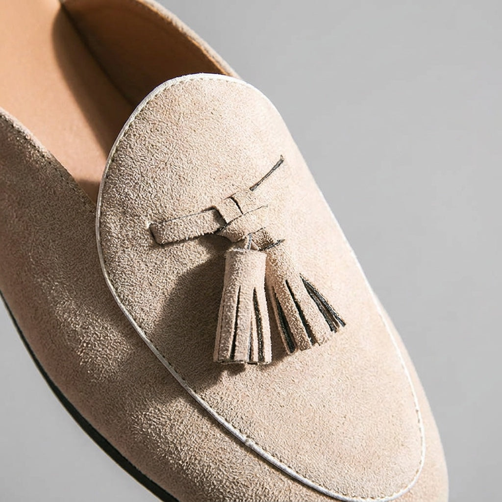 Pienza Suede Mules — Beige, close-up tassel and vamp suede texture