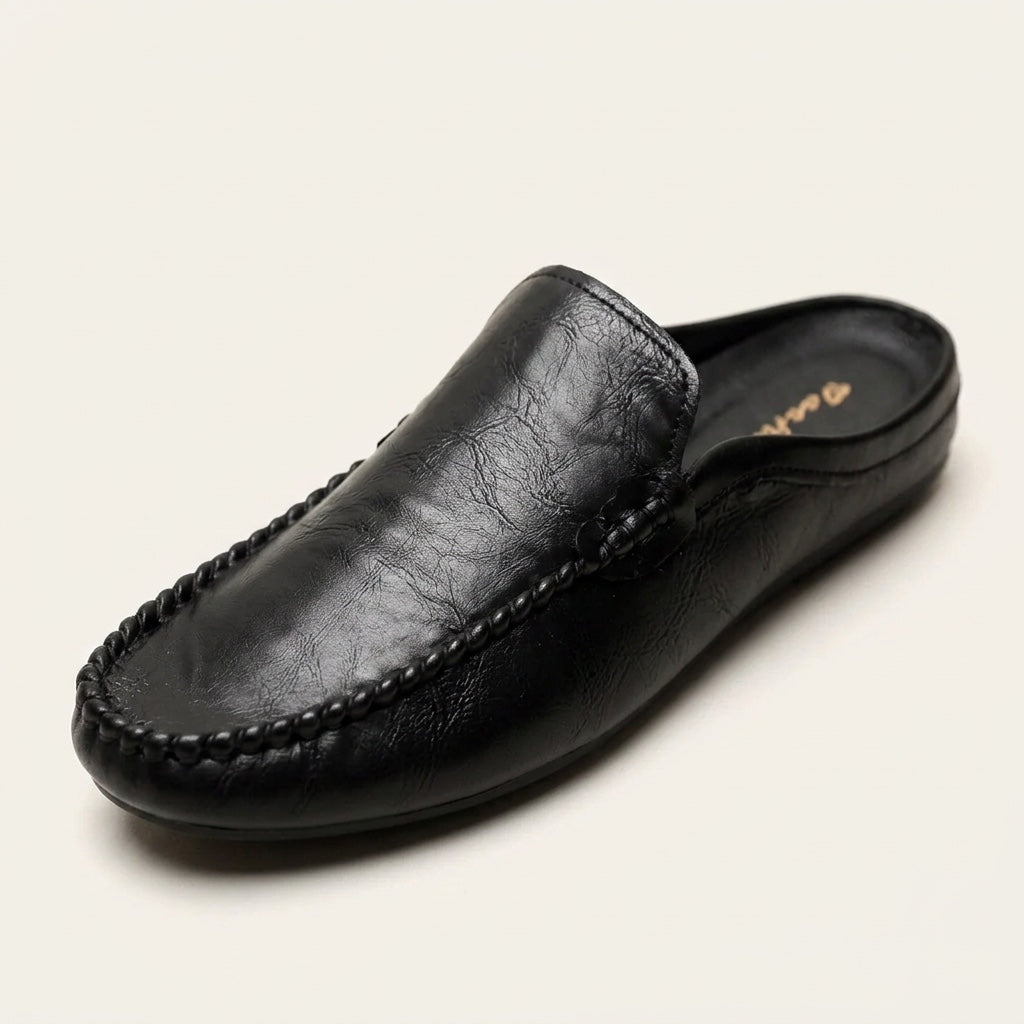 Maiori Leather Mules — Black, three-quarter studio view
