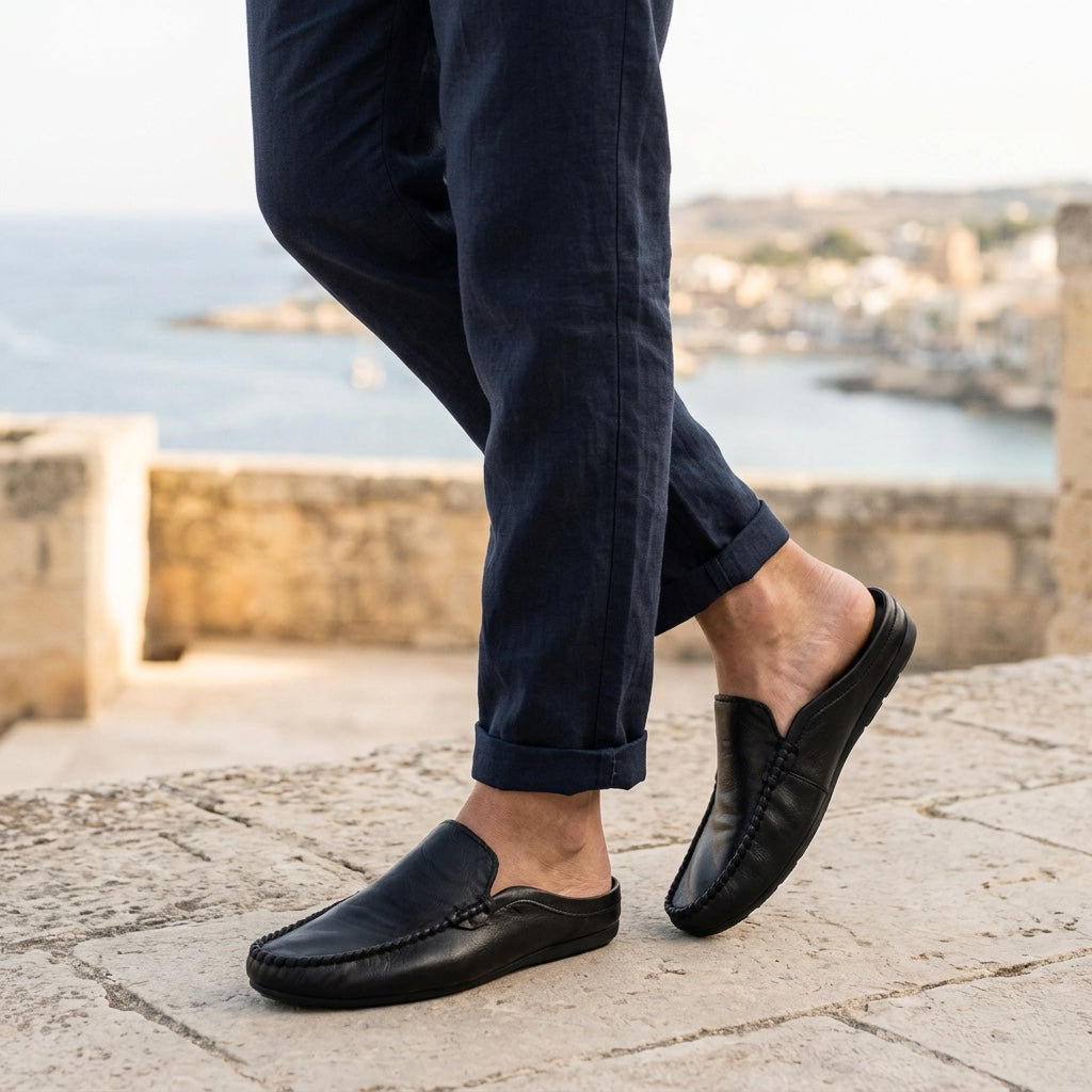 Maiori Leather Mules — Black, coastal terrace lifestyle