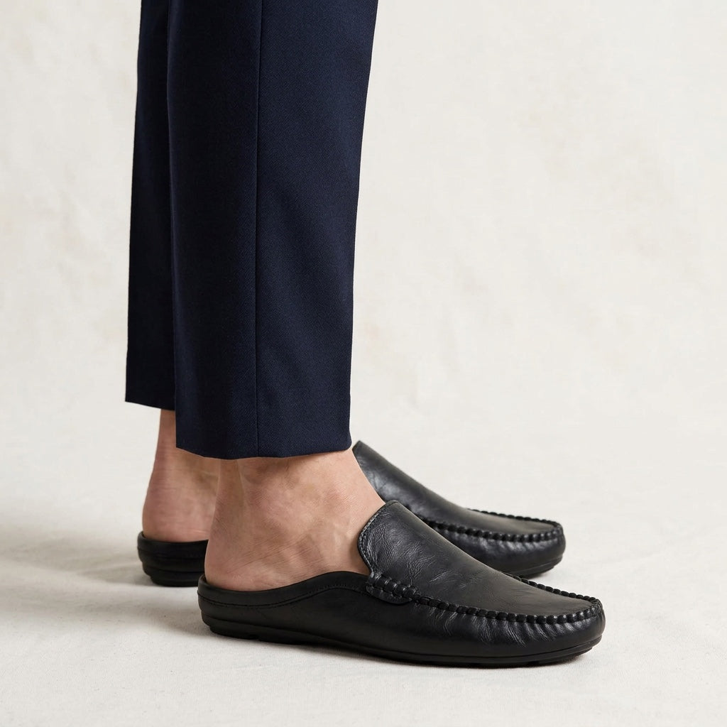 Maiori Leather Mules — Black, studio model knees down