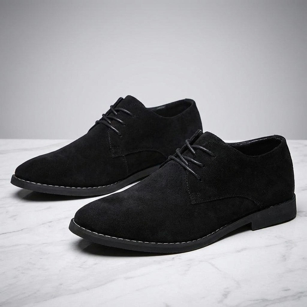 Lecce Suede Oxfords — Black, pair on marble