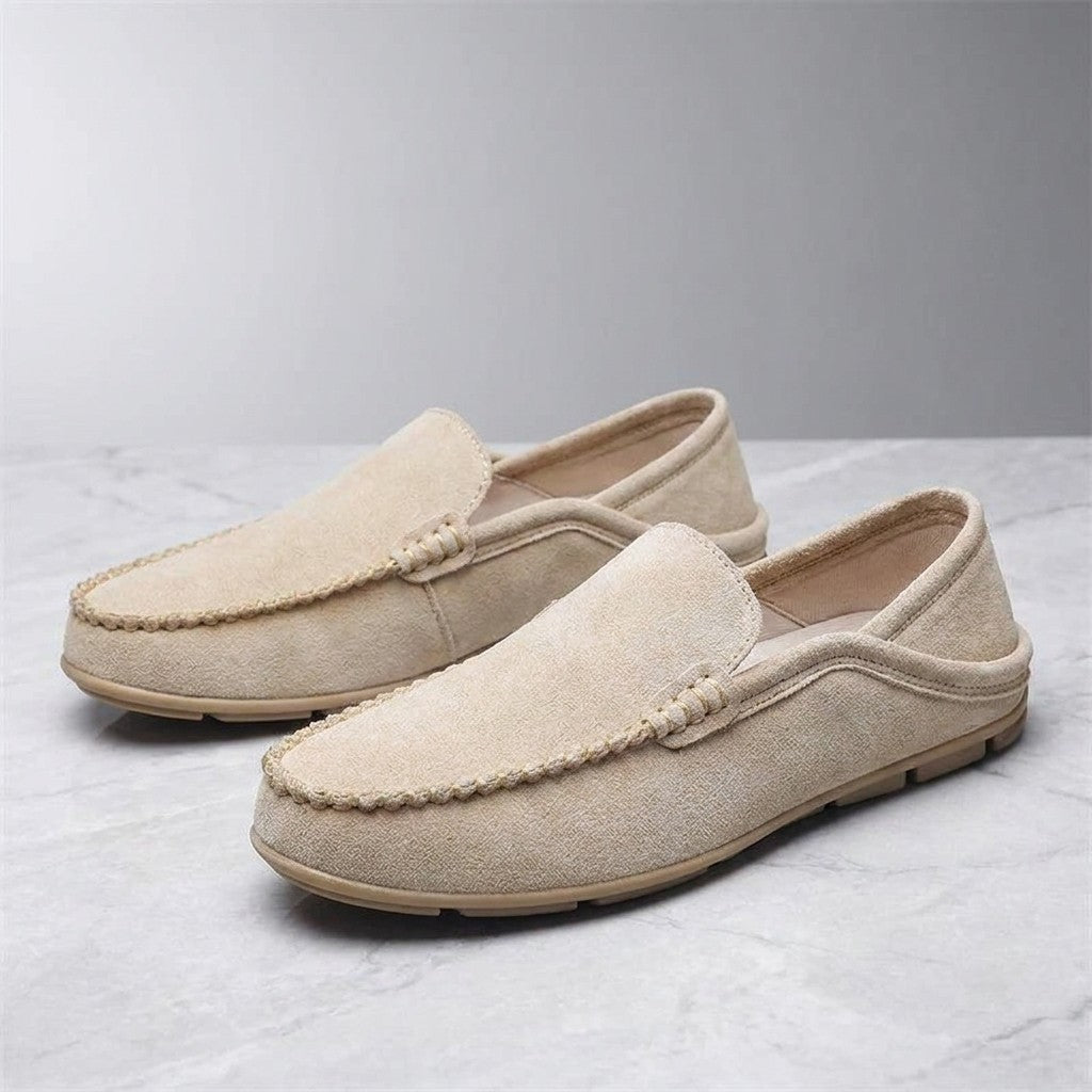 Cervia Suede Loafers — Khaki, pair of loafers, three-quarter view on light grey marble