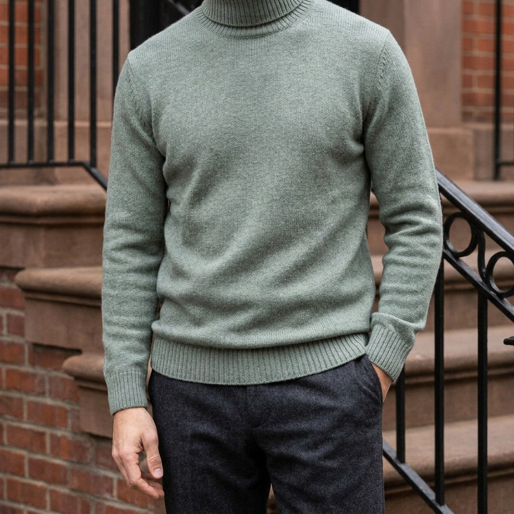Macerata Merino Wool Turtleneck — Sage, worn on a brownstone stoop