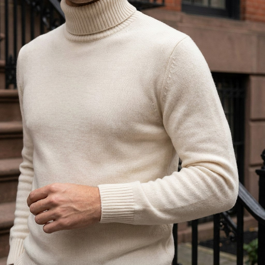 Macerata Merino Wool Turtleneck — Cream, worn close-up of the cuff and knit