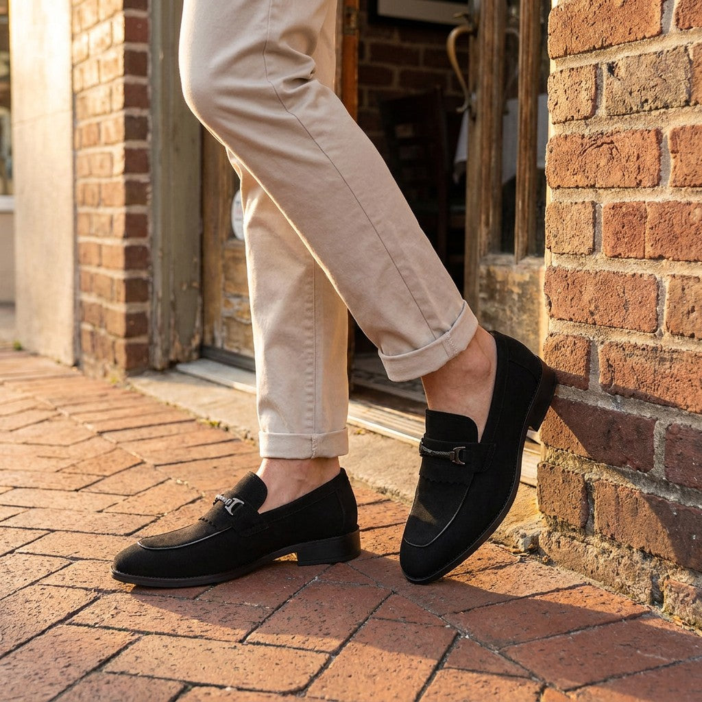 Maratea Kiltie Bit Loafers — Black, worn with light chinos on a brick sidewalk