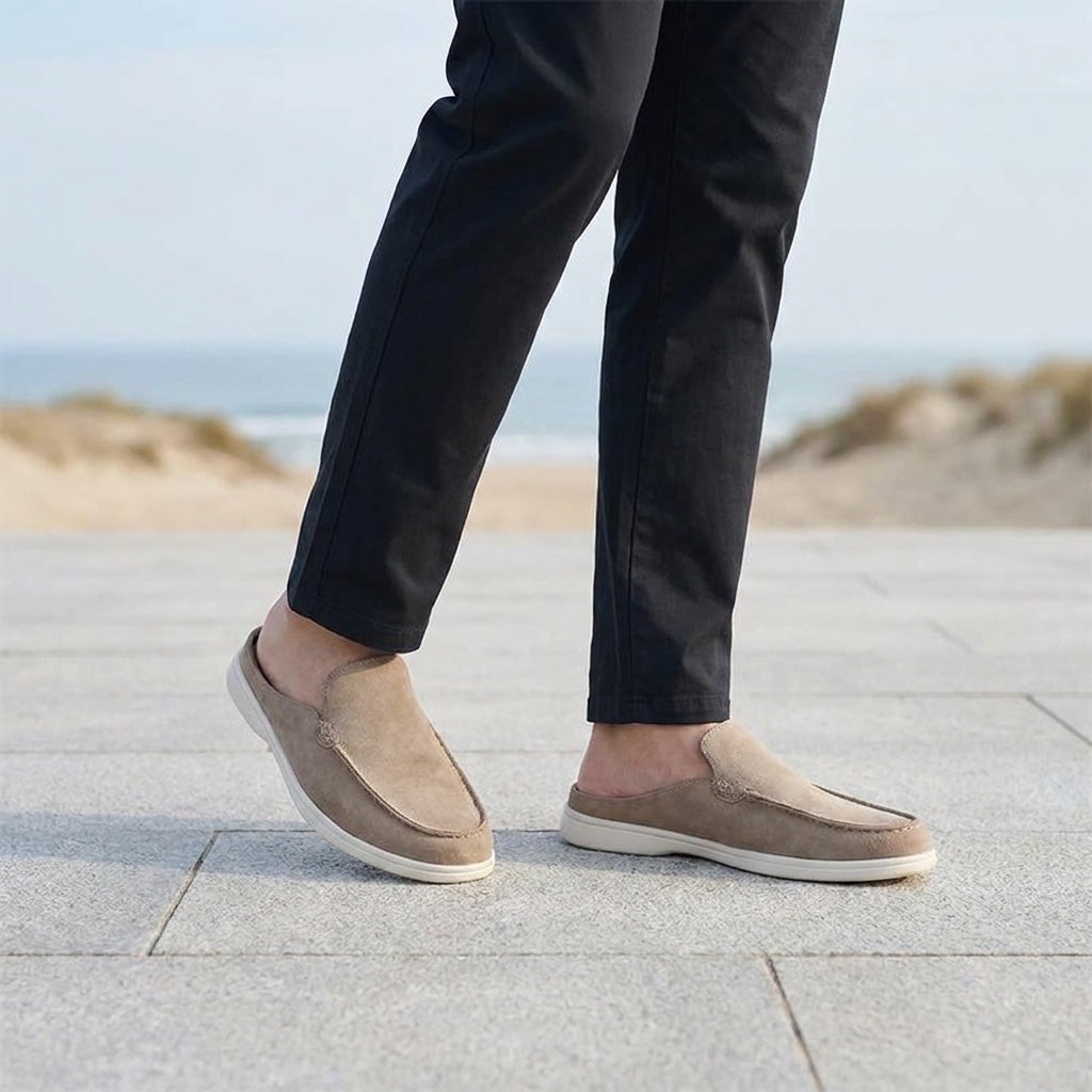 Falmouth Suede Loafers — Beige, male model knee-down coastal pavement