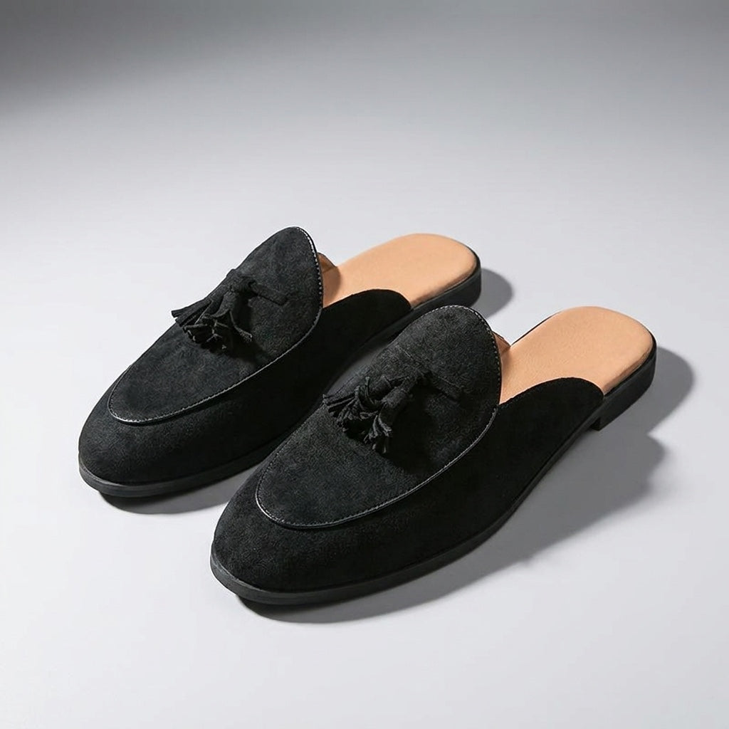 Pienza Suede Mules — Black, three-quarter front view, both shoes paired, open-back visible