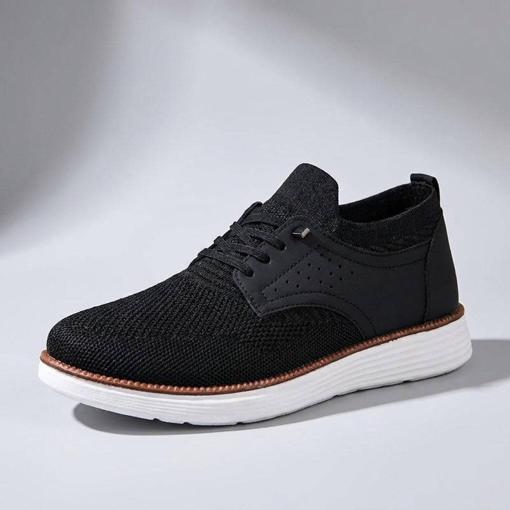 Formia Mesh Sneakers — Black, three-quarter studio view, light-grey gradient backdrop