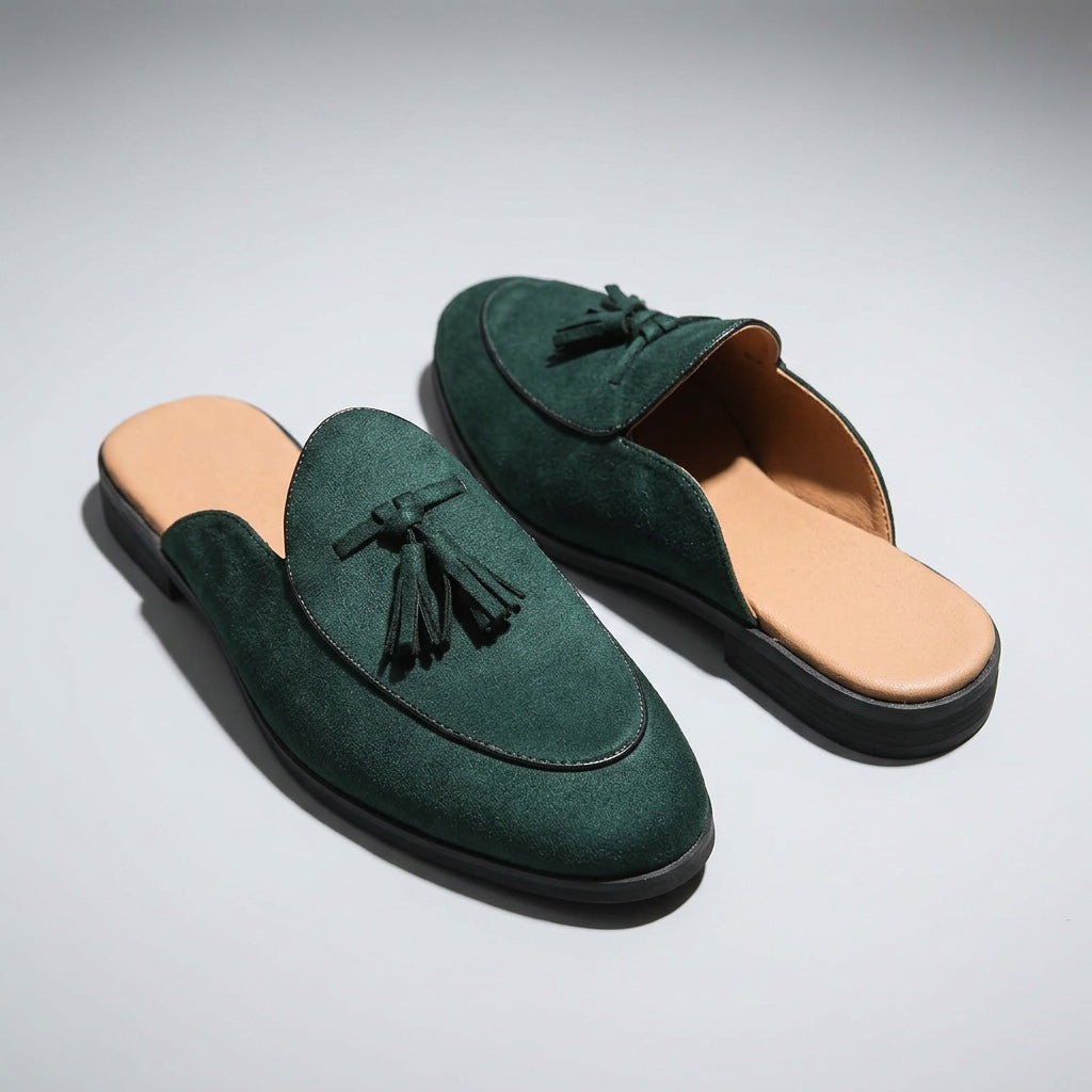 Pienza Suede Mules — Dark Green, three-quarter front view, both shoes paired, open-back visible