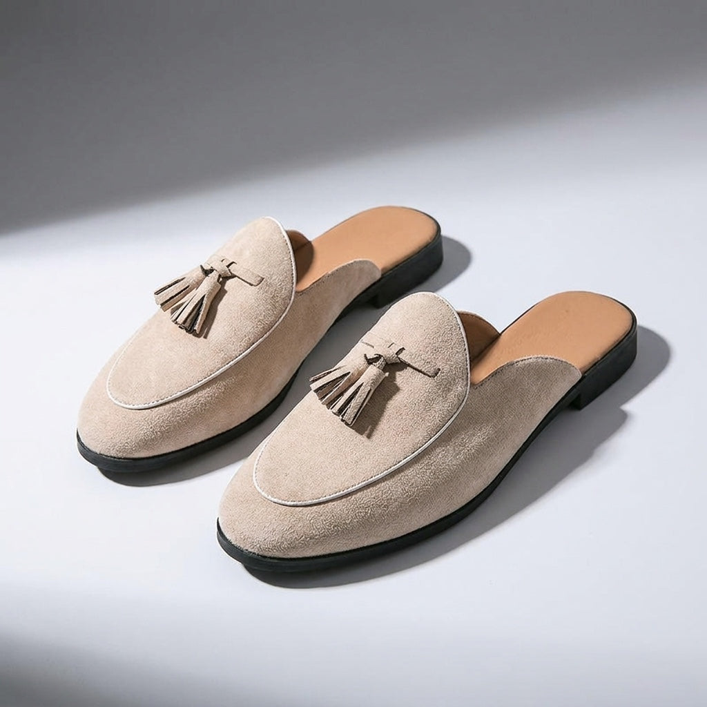 Pienza Suede Mules — Beige, three-quarter front view, both shoes paired, open-back visible
