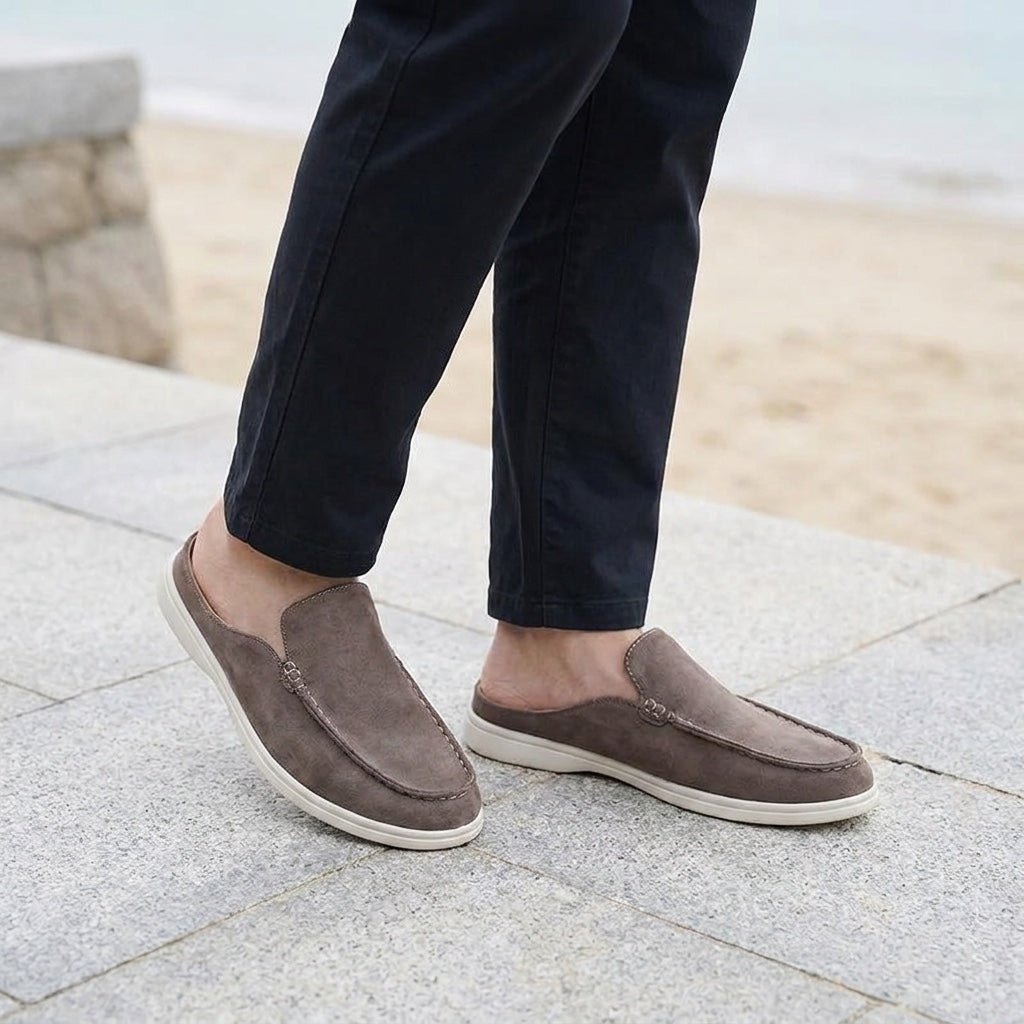 Falmouth Suede Loafers — Brown, male model knee-down coastal pavement