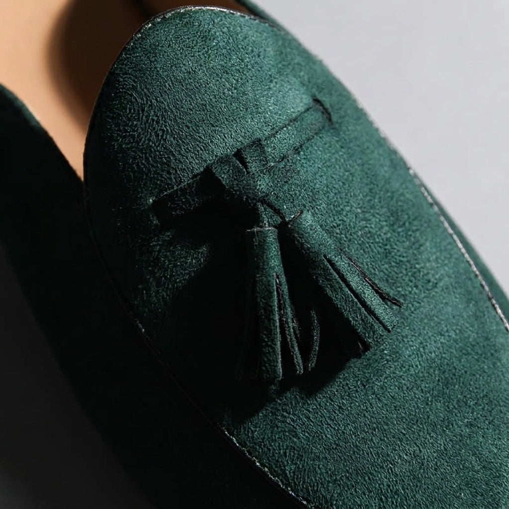 Pienza Suede Mules — Dark Green, close-up tassel and vamp suede texture