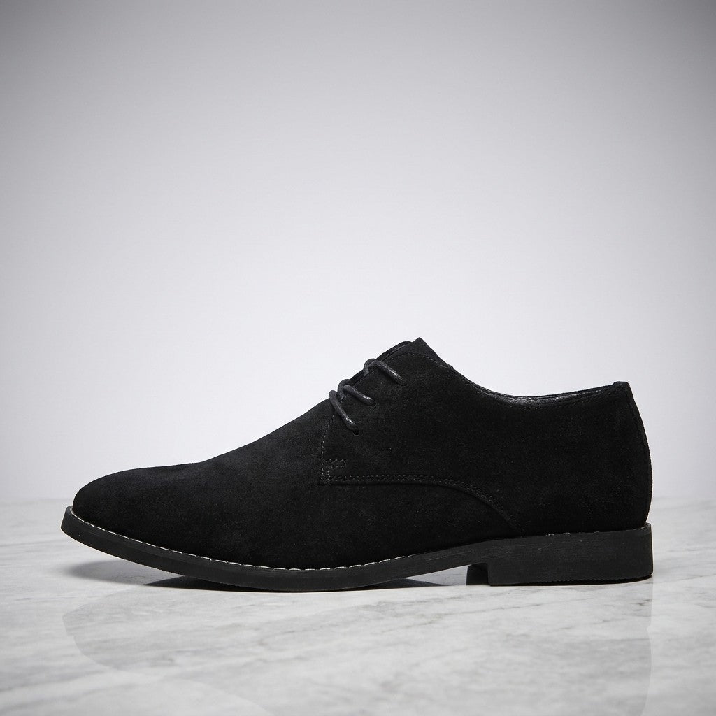 Lecce Suede Oxfords — Black, side profile on marble