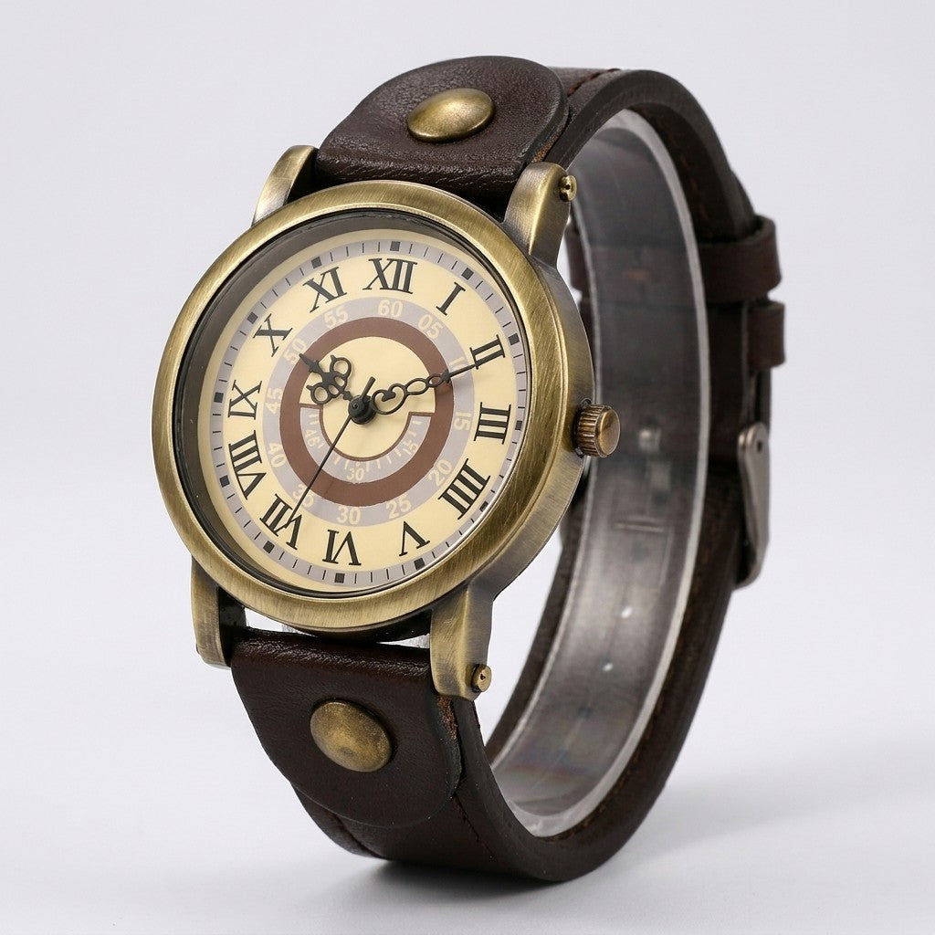 Tarquinia Bronze-Tone Watch — Bronze / Dark Brown, cream Roman-numeral dial on a light-grey studio backdrop