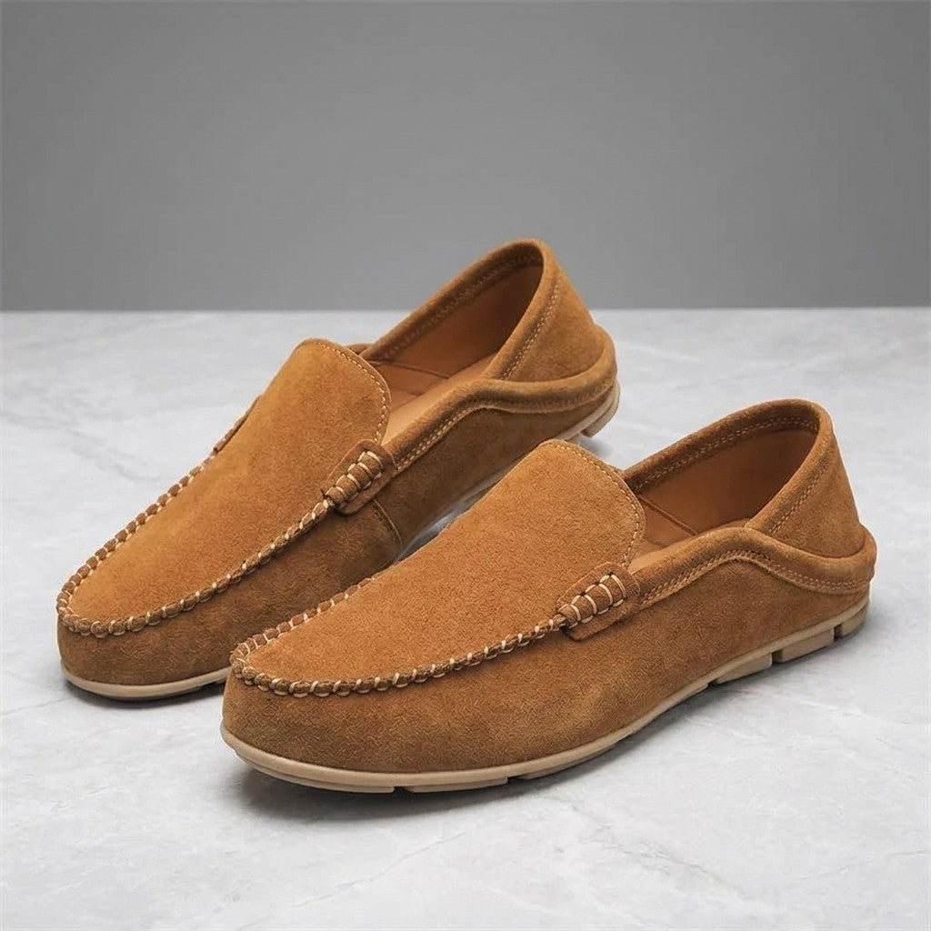 Cervia Suede Loafers — Apricot, pair of loafers, three-quarter view on light grey marble