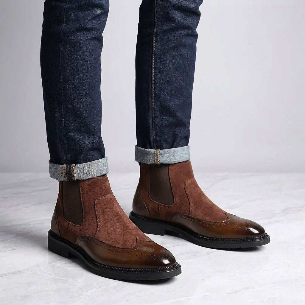 Dozza Brogue Chelsea Boots — Brown, worn with cuffed dark jeans, knee-down on light grey marble