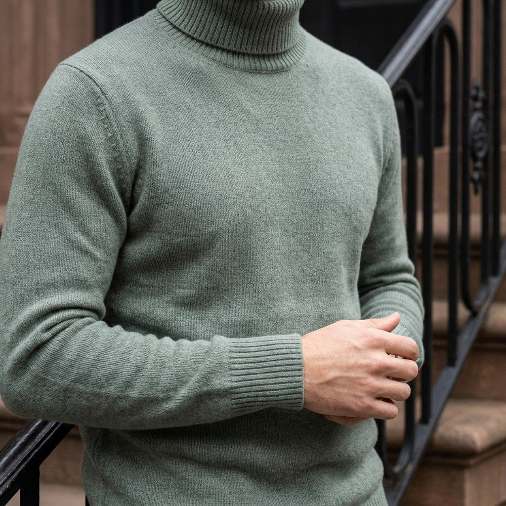 Macerata Merino Wool Turtleneck — Sage, worn close-up of the cuff and knit