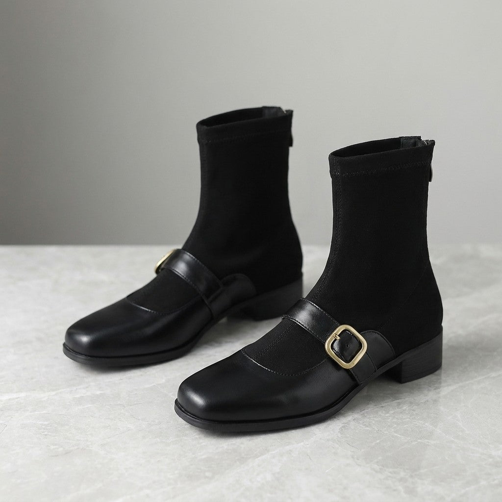 Sondrio Buckled Ankle Boots — Black, pair, three-quarter studio view on grey marble