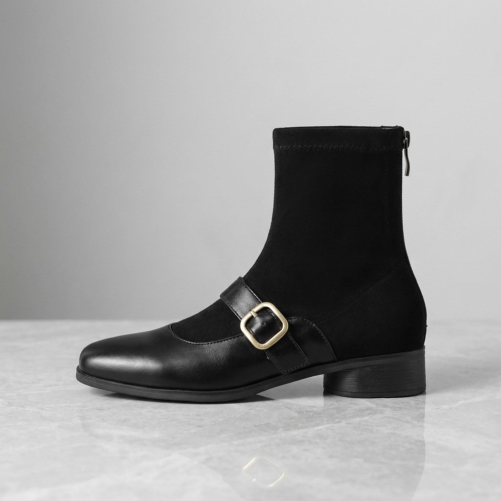Sondrio Buckled Ankle Boots — Black, single boot, side profile on grey marble